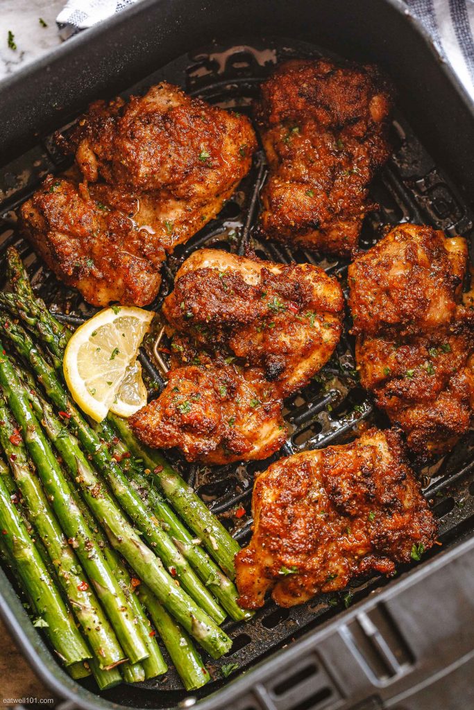 Chicken thighs and asparagus in an air fryer