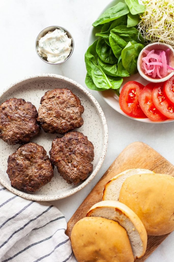 4 air fried burgers with salad and buns