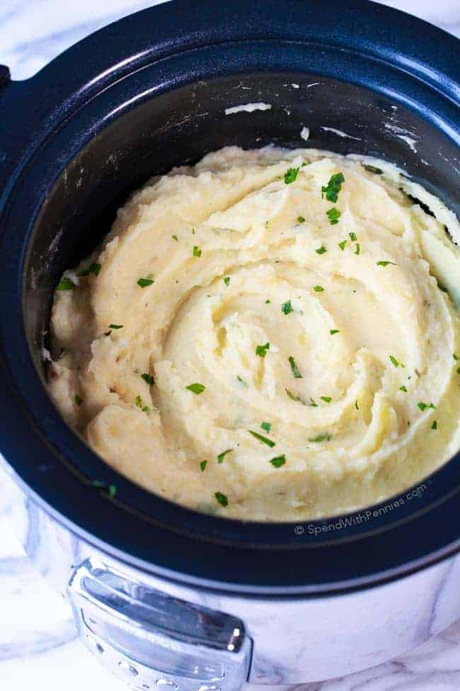 Mashed potatoes with herbs in a slow cooker