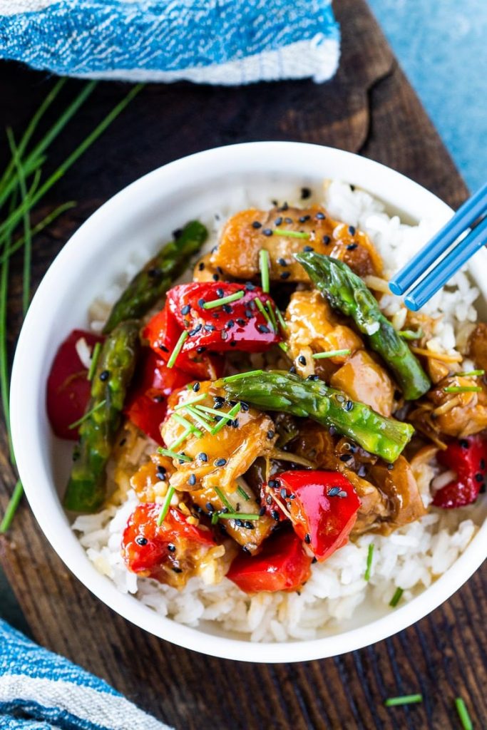 Chinese chicken cooked with teriyaki sauce, red peppers and asparagus